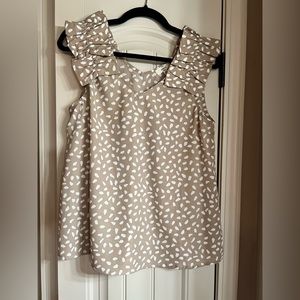 Cute neutral tan and white polka dot tank with ruffle straps